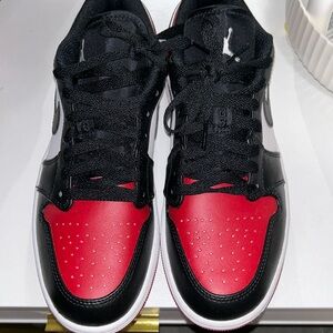 Nike red and black air jordan low